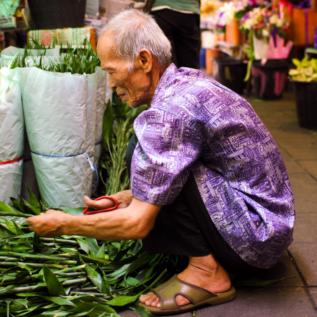 Preparing bamboo leafs, flower market, Bangkok
