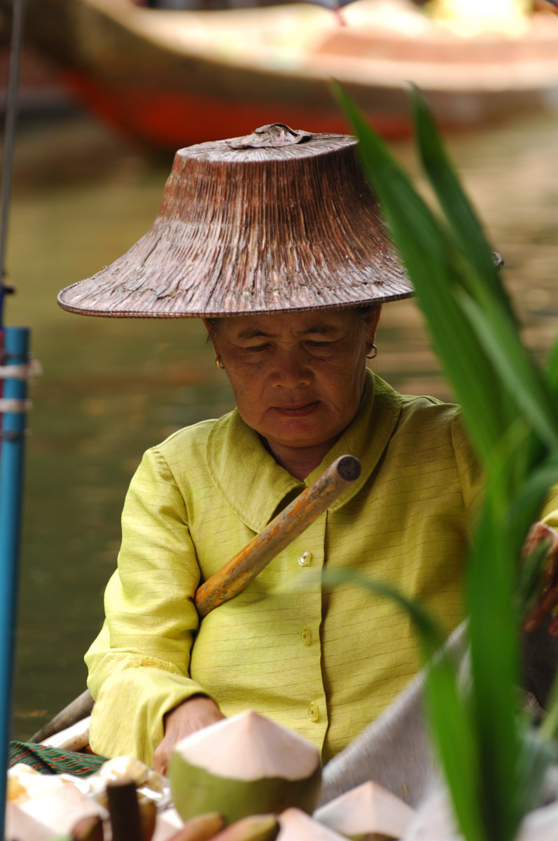 Woman at floating market, Damnoen Saduak, Thailand